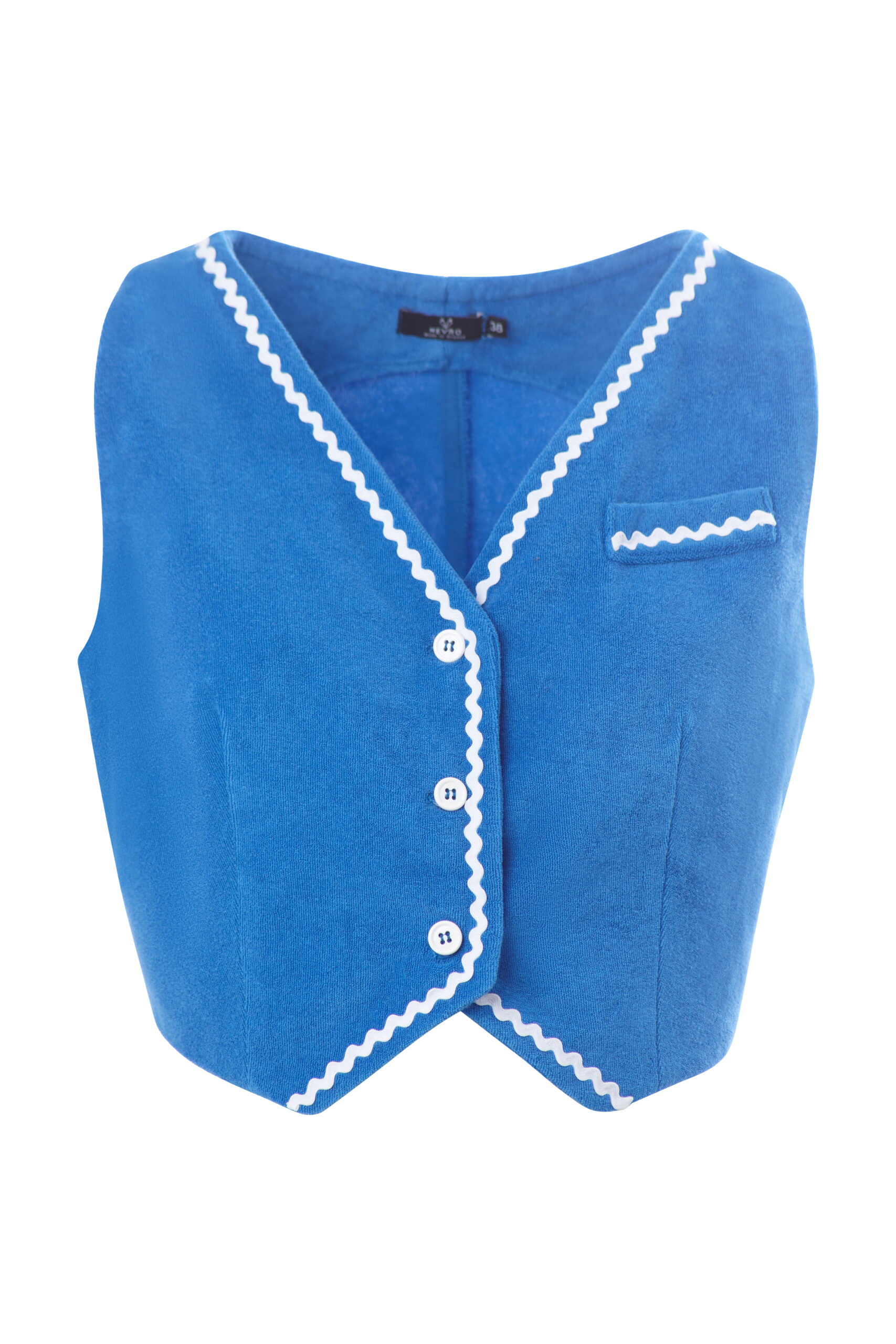 The Icarus Terry Vest is a sunlit essential—cut from Cycladic-blue terry cloth with sculpted edges, zigzag white trimming, and crisp single-breasted tailoring.